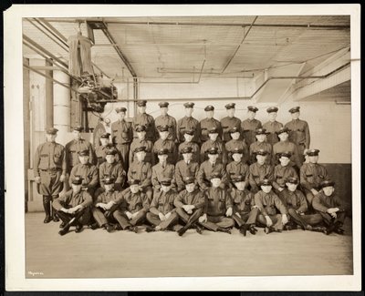 Group portrait of uniformed drivers and delivery men for the Carolyn Laundry at 111 East 128th Street, East Harlem, New York, 1928 by Byron Company